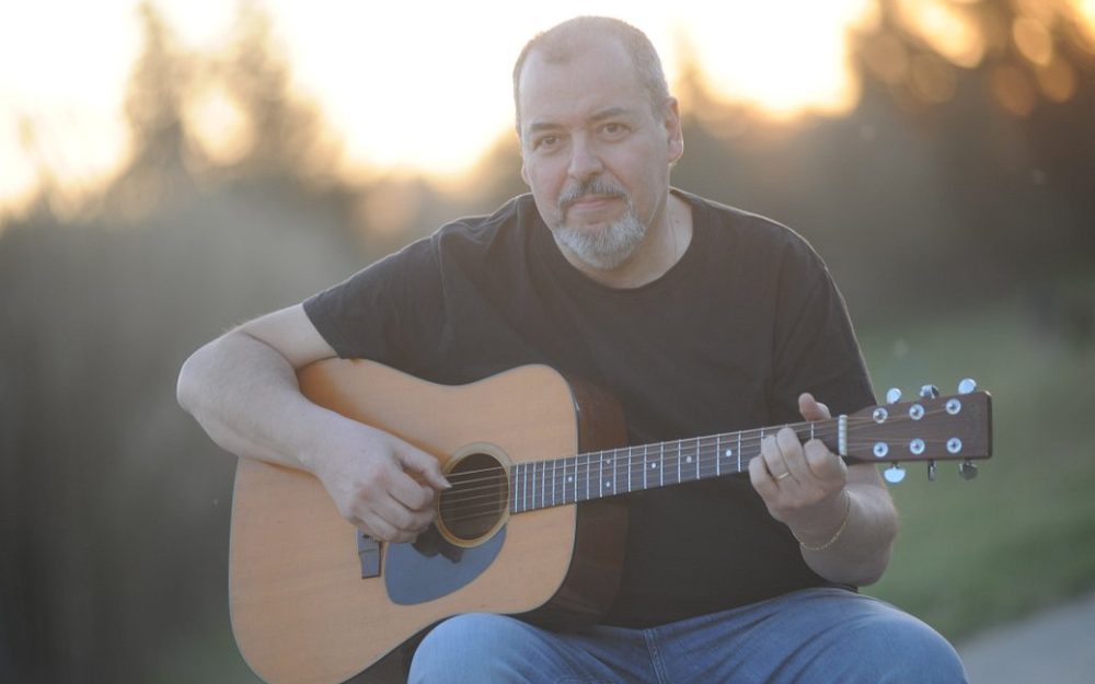 Walter Muto playing guitar
